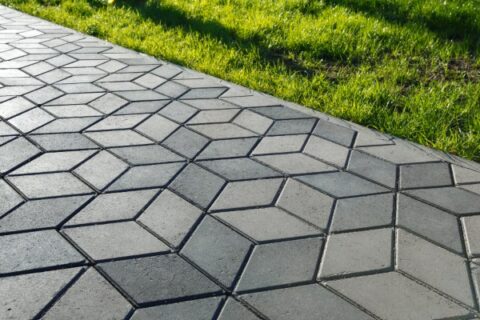 The footpath in the park is paved with diamond-shaped concrete tiles, Orange County, CA